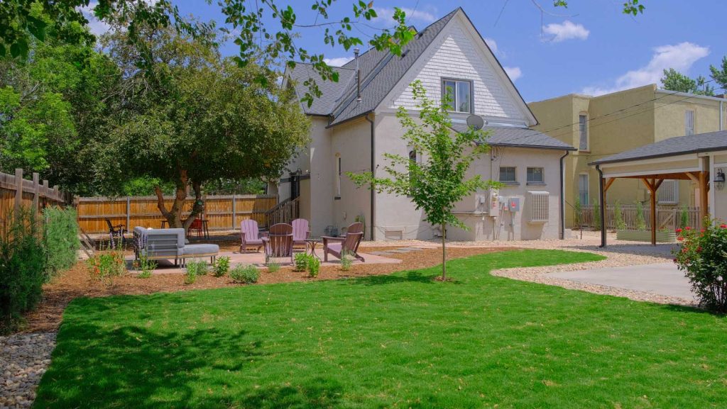 West Denver Landscaped Design in a backyard with patio and green grass