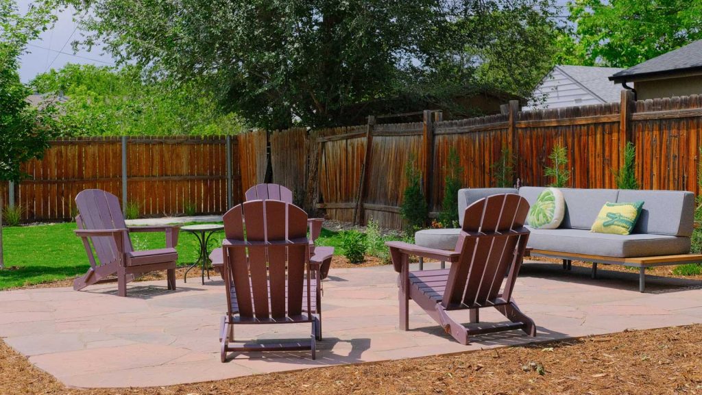 west denver landscaping hardscaping flagstone patio adirondack chairs outdoor sofa turf after