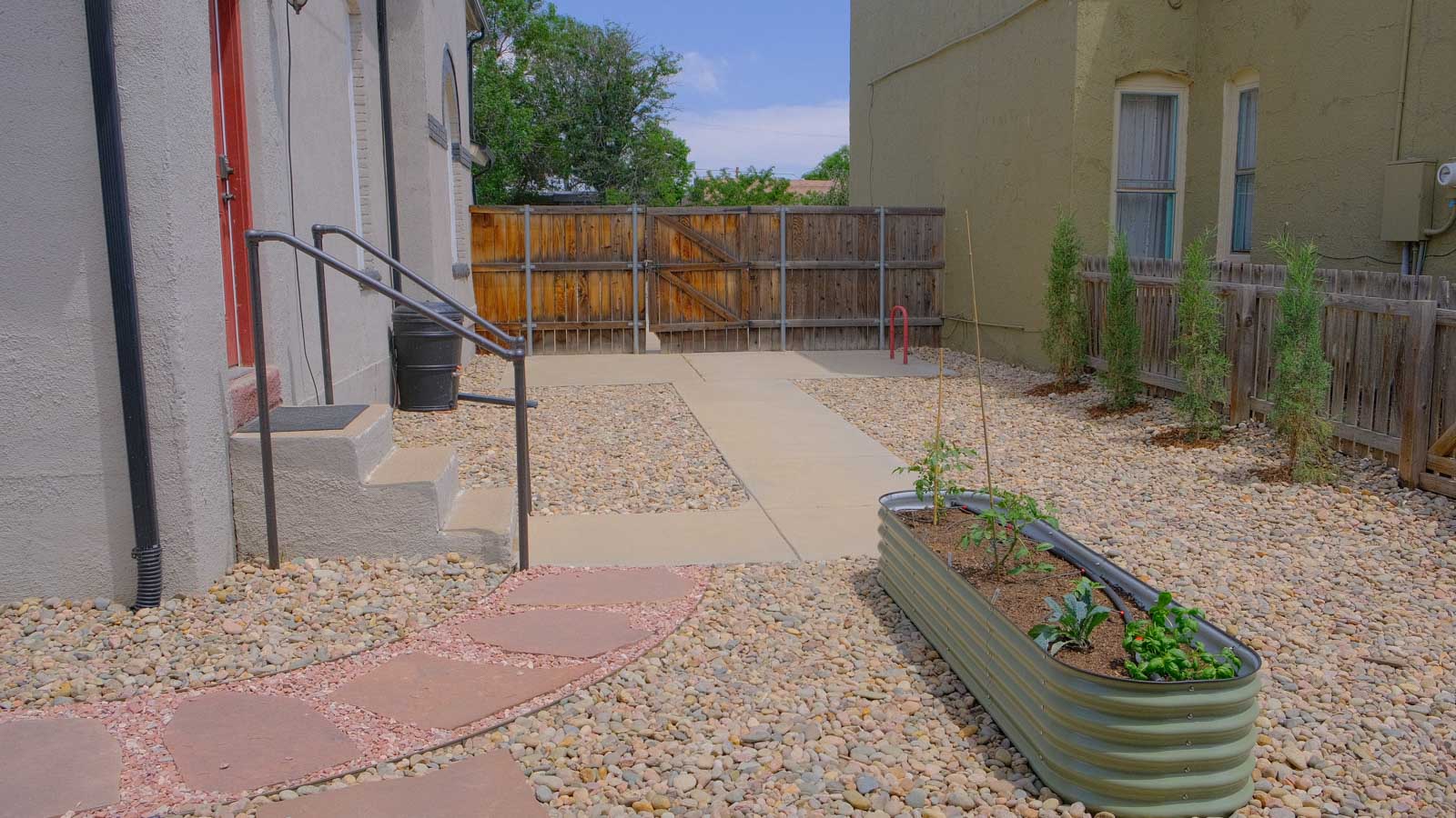 West Denver landscaping after: transformed side entry with flagstone path